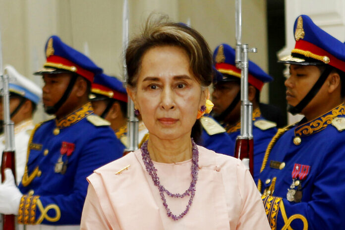 FILE - Myanmar's State Counselor Aung San Suu Kyi reviews an honor guard at the Peace Palace in Phnom Penh, Cambodia on April 30, 2019. Photo: Heng Sinith / AP File