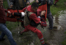 European Leaders Blast Cutoff of Russian Gas as ‘Blackmail’ An emergency worker is helped by locals to carry a man to an ambulance following a Russian bombardment in Kharkiv, Ukraine, Wednesday, April 27, 2022. Photo: Felipe Dana / AP