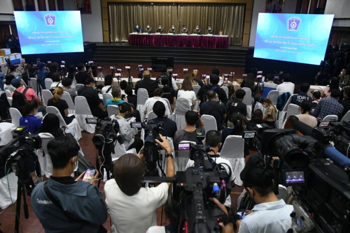 Photographers and journalists at a police press conference on the investigation into the death of actress Nida 