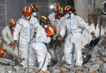 Survivor Found Almost 6 Days After China Building Collapse In this photo released by Xinhua News Agency, rescue workers evacuate the 10th survivor pulled alive after being trapped 132 hours from the debris of a self-built residential structure that collapsed in Changsha in central China's Hunan Province on Thursday May 5, 2022. Photo: Shen Hong / Xinhua via AP
