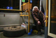 “Everything Shook”: Last Civilians Leave Ukraine Steel Mill A woman who fled from the Azovstal steel plant in Mariupol waits in a bus to be processed upon her arrival to a reception center for displaced people in Zaporizhzhia, Ukraine, Sunday, May 8, 2022. Photo: Francisco Seco / AP