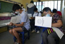 Dictator’s Son a Front-runner as Filipinos Elect Next Leader Voters cast their ballots on Monday, May 9, 2022, in Quezon City, Philippines. Photo: Aaron Favila / AP