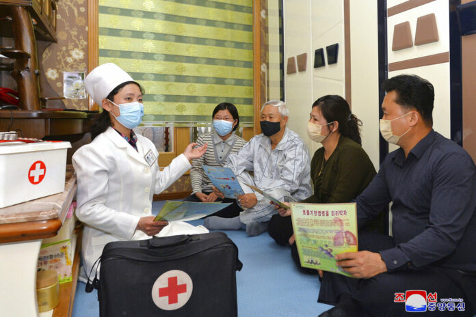 In this photo provided by the North Korean government, a doctor visits a family during an activity to raise public awareness of the COVID-19 prevention measures, in Pyongyang, North Korea Tuesday, May 17, 2022. Photo: Korean Central News Agency / Korea News Service via AP