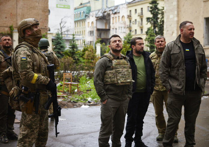 In this photo provided by the Ukrainian Presidential Press Office on Sunday, May 29, 2022, Ukrainian President Volodymyr Zelenskyy, centre, inspects damaged buildings, as he visits the war-hit Kharkiv region. Photo: Ukrainian Presidential Press Office via AP