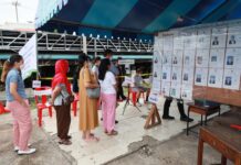 Opinion: What Can We Expect From Leading Candidates as New Bangkok Governor? Voters line up at a polling station in Bangkok's Kannayao district to cast their vote for Bangkok gubernatorial election on May 22, 2022.