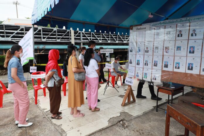 Voters line up at a polling station in Bangkok's Kannayao district to cast their vote for Bangkok gubernatorial election on May 22, 2022.