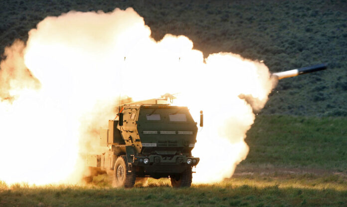 FILE - In this May 23, 2011, file photo a launch truck fires the High Mobility Artillery Rocket System (HIMARS) produced by Lockheed Martin during combat training in the high desert of the Yakima Training Center, Wash. Photo: Tony Overman / The Olympian via AP File FILE - In this May 23, 2011, file photo a launch truck fires the High Mobility Artillery Rocket System (HIMARS) produced by Lockheed Martin during combat training in the high desert of the Yakima Training Center, Wash. Photo: Tony Overman / The Olympian via AP File