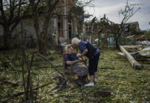 Putin Warns West Against Sending Arms; Kyiv Hit by Missiles Elena Holovko sits among debris outside her house damaged after a missile strike in Druzhkivka, eastern Ukraine, Sunday, June 5, 2022. Photo: Bernat Armangue / AP