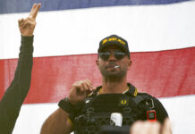 Proud Boys Charged With Seditious Conspiracy in Capitol Riot FILE - Proud Boys leader Enrique Tarrio wears a hat that says The War Boys and smokes a cigarette at a rally in Delta Park on Sept. 26, 2020, in Portland, Ore. Photo: Allison Dinner / AP File