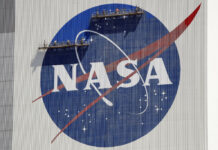 NASA Launches Study of UFOs Despite ‘Reputational Risk’ FILE - Workers on scaffolding repaint the NASA logo near the top of the Vehicle Assembly Building at the Kennedy Space Center in Cape Canaveral, Fla., Wednesday, May 20, 2020. Photo: John Raoux / AP File