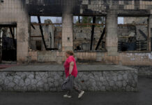 Russians Control 80% Of Key Ukraine City, Cut Escape Routes A woman heads to the market in Makariv, on the outskirts of Kyiv, Ukraine, Tuesday, June 14, 2022. Photo: Natacha Pisarenko / AP