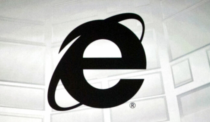 FILE - The Microsoft Internet Explorer logo is projected on a screen during a Microsoft Xbox E3 media briefing in Los Angeles, June 4, 2012. Photo: Damian Dovarganes / AP File
