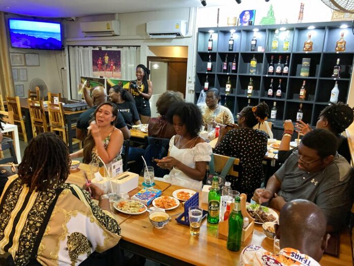 About 20 people of African descent living abroad gather for dinner at a Jamaican restaurant in Bangkok, Thailand to celebrate America’s newest federal holiday, Juneteenth on Saturday, June 18, 2022, in Bangkok, Thailand. Photo: Annika Wolters / AP