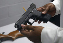 US Supreme Court Expands Gun Rights, With Nation Divided FILE - A handgun from a collection of illegal guns is reviewed during a gun buyback event in Brooklyn, N.Y., May 22, 2021. Photo: Bebeto Matthews / AP FIle