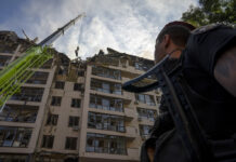 Russia Strikes Kyiv as Western Leaders Meet in Europe Servicemen work at the scene at a residential building following explosions, in Kyiv, Ukraine, Sunday, June 26, 2022. Photo: Nariman El-Mofty / AP