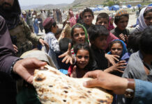Death Toll of Children in Afghanistan Quake Rises to 155 Afghans receive aid at a camp after an earthquake in Gayan district in Paktika province, Afghanistan, Sunday, June 26, 2022. Photo: Ebrahim Nooroozi / AP