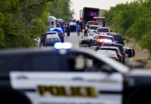 46 Migrants Found Dead in Abandoned Trailer in San Antonio Police block the scene where a semitrailer with multiple dead bodies was discovered, Monday, June 27, 2022, in San Antonio. Photo: Eric Gay / AP