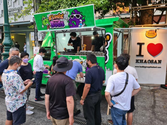Customers queue up to buy cannabis at a cannabis truck on Khaosan Road on June 11, 2022. Customers queue up to buy cannabis at a cannabis truck on Khaosan Road on June 11, 2022.