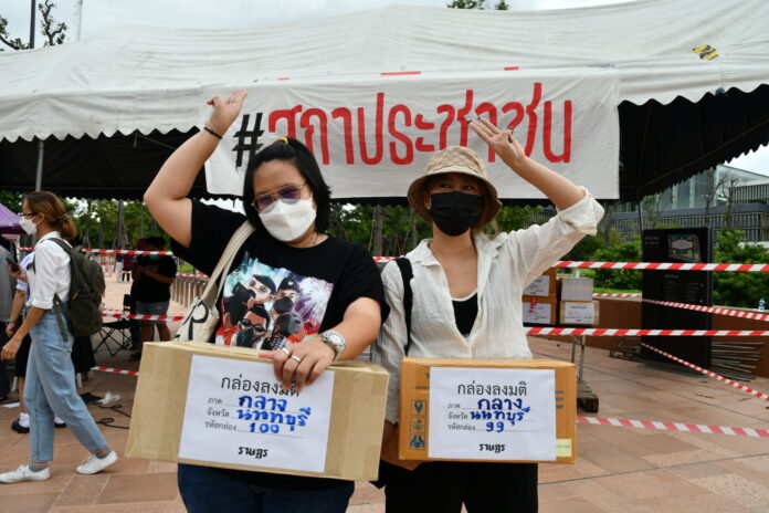 Anti-government protesters hold boxes of people's no-confidence votes during a protest in front of the parliament on July 19, 2022. Anti-government protesters hold boxes of people's no-confidence votes during a protest in front of the parliament on July 19, 2022.