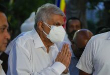 Sri Lanka’s Newly Elected President Sworn Into Office President elect Ranil Wickremesinghe greats supporters upon his arrival at a buddhist temple in Colombo, Sri Lanka, Wednesday, July 20, 2022. Photo: Eranga Jayawardena / AP