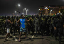Rajapaksa Ally Named PM in Sri Lanka as Protest Site Cleared A protester shouts slogans as army soldiers arrive to remove protesters from the site of a protest camp outside the Presidential Secretariat in Colombo, Sri Lanka, Friday, July 22, 2022. Photo: Rafiq Maqbool / AP