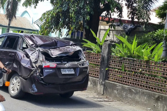 A damaged car is seen along a road after a strong quake hit Bangued, Abra province, northern Philippines on Wednesday July 27, 2022. Photo: Raphiel Alzate / AP