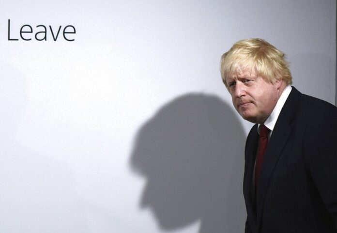 FILE - Vote Leave campaigner Boris Johnson arrives for a press conference at Vote Leave headquarters in London Friday, June 24, 2016. Photo: Mary Turner / Pool via AP File
