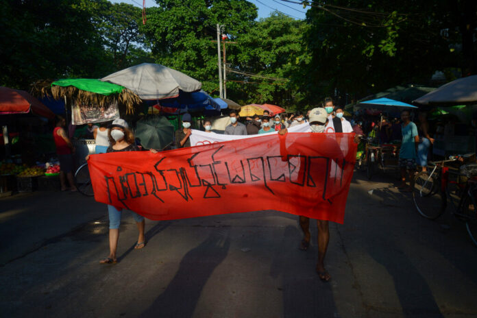 FILE - People march to protest against the February military takeover, in Yangon, Myanmar, on April 11, 2021. Photo: AP File FILE - People march to protest against the February military takeover, in Yangon, Myanmar, on April 11, 2021. Photo: AP File