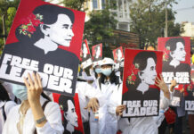 UN Envoy Travels to Strife-torn Myanmar for the First Time FILE - Medicals students display images of deposed Myanmar leader Aung San Suu Kyi during a street march in Yangon, Myanmar, on Feb. 28, 2021. A Myanmar court convicted Suu Kyi in more corruption cases Monday, Aug. 15, 2022, adding six years to prison sentence. Photo: AP File