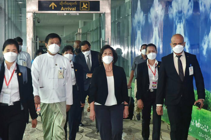 In this image provided by the Military True News Information Team, United Nations special envoy Noeleen Heyzer, center, arrives at the Yangon International Airport, Tuesday, Aug. 16, 2022, in Yangon, Myanmar. Photo: Myanmar True News information Team via AP