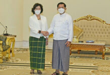 UN Envoy Tells Myanmar General: End Violence, Seek Democracy In this image provided by the Military True News Information Team, United Nations special envoy Noeleen Heyzer, left, and State Administration Council Chairman Senior Gen. Min Aung Hlaing shake hands Wednesday, Aug. 17, 2022, in Naypyitaw, Myanmar. Photo: Myanmar True News Information Team via AP