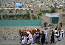 Bombing at Kabul Mosque Kills 10, Including Prominent Cleric Mourners carry the body of a victim of a mosque bombing in Kabul, Afghanistan, Thursday, Aug. 18. 2022. Photo: Ebrahim Noroozi / AP