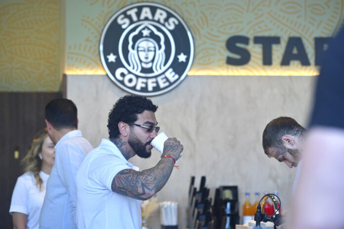 Russian singer and entrepreneur Timur Yunusov, better known as Timati, drinks coffee at a newly opened Stars Coffee coffee shop in the former location of the Starbucks coffee shop in Moscow, Russia, Thursday, Aug. 18, 2022. Photo: Dmitry Serebryakov / AP Russian singer and entrepreneur Timur Yunusov, better known as Timati, drinks coffee at a newly opened Stars Coffee coffee shop in the former location of the Starbucks coffee shop in Moscow, Russia, Thursday, Aug. 18, 2022. Photo: Dmitry Serebryakov / AP