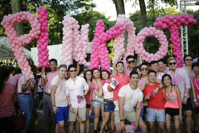 FILE - Thousands of people gathered at a park for the annual Pink Dot gay pride event on Saturday, July 1, 2017, in Singapore. Photo: Wong Maye-E / AP File