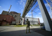 Ukrainian Fears Run High Over Fighting Near Nuclear Plant FILE - A Russian serviceman guards an area of the Zaporizhzhia Nuclear Power Station in territory under Russian military control, southeastern Ukraine, May 1, 2022. Photo: AP File