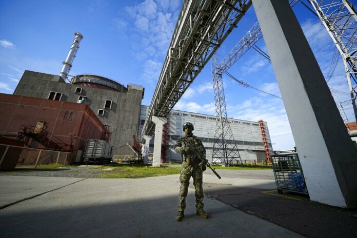 FILE - A Russian serviceman guards an area of the Zaporizhzhia Nuclear Power Station in territory under Russian military control, southeastern Ukraine, May 1, 2022. Photo: AP File