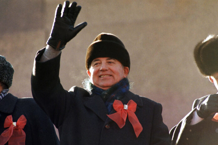 FILE - Soviet leader Mikhail Gorbachev waves from the parade review stand of the Lenin Mausoleum on Saturday, Nov. 7, 1987 in Moscow' s Red Square during the 70th anniversary of the Russian Revolution. Photo: Boris Yurchenko / AP