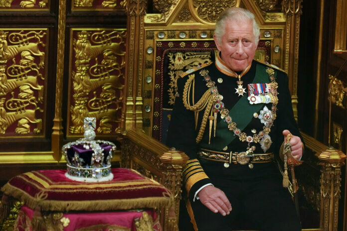 FILE - Prince Charles is seated next to the Queen's crown during the State Opening of Parliament, at the Palace of Westminster in London, May 10, 2022. Photo: Alastair Grant / Pool, AP File