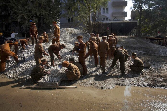 FILE - North Korean construction workers labor in the Mansudae area of Pyongyang, North Korea, Oct. 11, 2011. Photo: David Guttenfelder / AP File