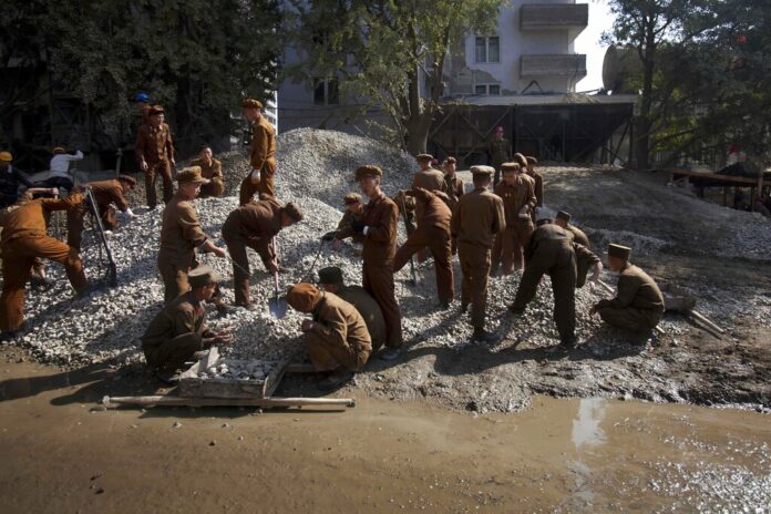 FILE - North Korean construction workers labor in the Mansudae area of Pyongyang, North Korea, Oct. 11, 2011. Photo: David Guttenfelder / AP File FILE - North Korean construction workers labor in the Mansudae area of Pyongyang, North Korea, Oct. 11, 2011. Photo: David Guttenfelder / AP File
