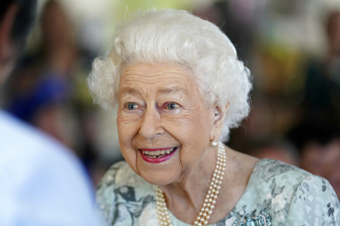 FILE - Britain's Queen Elizabeth II looks on during a visit to officially open the new building at Thames Hospice, Maidenhead, England July 15, 2022. Photo: Kirsty O'Connor / Pool Photo via AP File