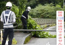 Storm Hits Southwest Japan, Leaves 1 Dead, Another Missing Workers clear debris broken by strong winds as a powerful typhoon hits the area in Kumamoto, southwestern Japan, Monday Sept. 19, 2022. Photo: Kyodo News via AP