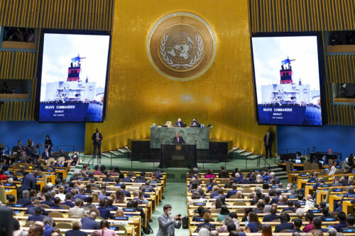 An image of the 'Brave Commander' ship carrying grain from Ukraine is displayed on screens as Secretary-General António Guterres addresses the 77th session of the General Assembly at United Nations headquarters Tuesday, Sept. 20, 2022. Photo: Mary Altaffer / AP