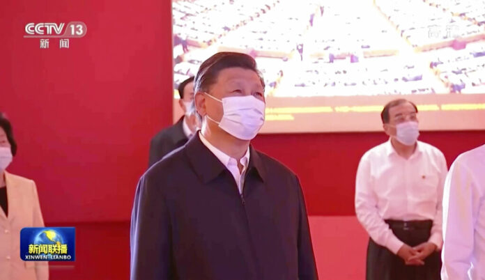 In this image taken from video footage run by China's CCTV, Chinese President Xi Jinping and other Chinese leaders visit an exhibit with the theme of In this image taken from video footage run by China's CCTV, Chinese President Xi Jinping and other Chinese leaders visit an exhibit with the theme of