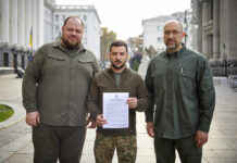 9 NATO Members Urge Support for Ukraine After Annexation In this photo provided by the Ukrainian Presidential Press Office, Ukrainian President Volodymyr Zelenskyy, center, alongside Prime Minister Denys Shmyhal, right, and the head of Verkhovna Rada (Supreme Council of Ukraine) Ruslan Stefanchuk, holds an application for ''accelerated accession to NATO'' in Kyiv, Ukraine, Friday Sept. 30, 2022. Photo: Ukrainian Presidential Press Office via AP