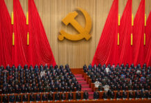 China’s Party Congress Promises Continuity, Not Change Delegates stand for a moment of silence during the opening ceremony of the 20th National Congress of China's ruling Communist Party at the Great Hall of the People in Beijing, China, Sunday, Oct. 16, 2022. Photo: Mark Schiefelbein / AP