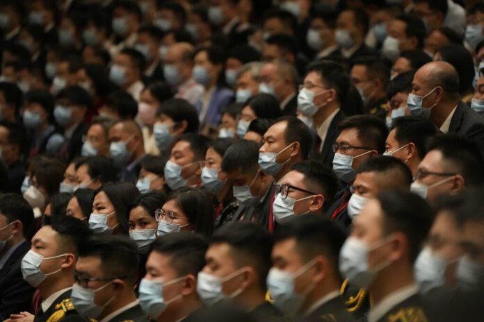 FILE - Delegates wearing masks attend the opening ceremony of the 20th National Congress of China's ruling Communist Party held at the Great Hall of the People in Beijing, China, Sunday, Oct. 16, 2022. Photo: Mark Schiefelbein / AP File