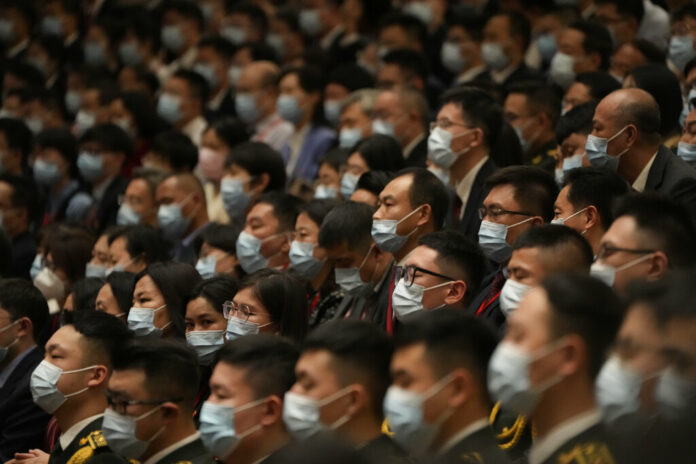 FILE - Delegates wearing masks attend the opening ceremony of the 20th National Congress of China's ruling Communist Party held at the Great Hall of the People in Beijing, China, Sunday, Oct. 16, 2022. Photo: Mark Schiefelbein / AP File FILE - Delegates wearing masks attend the opening ceremony of the 20th National Congress of China's ruling Communist Party held at the Great Hall of the People in Beijing, China, Sunday, Oct. 16, 2022. Photo: Mark Schiefelbein / AP File