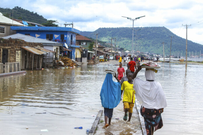 FILE- A view of stranded people due to floods following several days of downpours in Kogi Nigeria, Thursday, Oct. 6, 2022. Photo: Fatai Campbell / AP File FILE- A view of stranded people due to floods following several days of downpours in Kogi Nigeria, Thursday, Oct. 6, 2022. Photo: Fatai Campbell / AP File