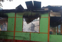 Myanmar Villagers Say Army Beheaded High School Teacher The wall of a school structure is left standing after it was burned in Taung Myint village in the Magway region of Myanmar on Sunday, Oct. 16, 2022. Photo: AP